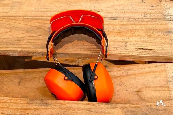 Groggle noise reduction earmuffs and construction safety glasses in orange