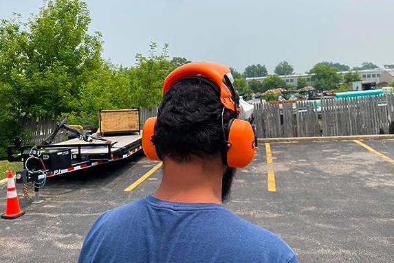 Groggle noise reduction earmuffs and construction safety glasses back view