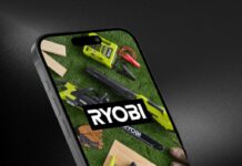 A smart phone against a background. On the phone screen displays the RYOBI app with a picture of various RYOBI power tools and OPE, with the RYOBI logo in the center.