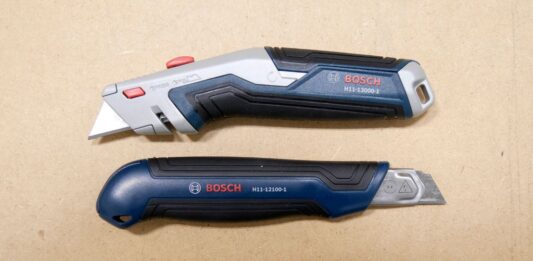 Three Bosch utility knives laid out over a work table. The knives from top to bottom are the BOSCH H11-12100-1 retractable utility knife, the BOSCH H11-13000-1 snap-off utility knife, and the BOSCH H11-11100-1 folding utility knife.