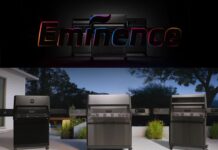 Monument Grills launches new flagship Eminence Series smart gas grills. In this pic is the E405 on a patio in a backyard with evergreens in the background.