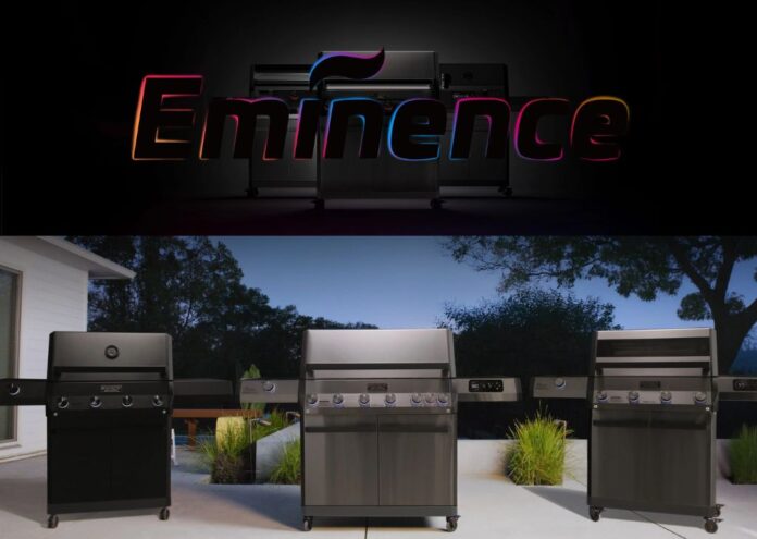 Monument Grills launches new flagship Eminence Series smart gas grills. In this pic is the E405 on a patio in a backyard with evergreens in the background.