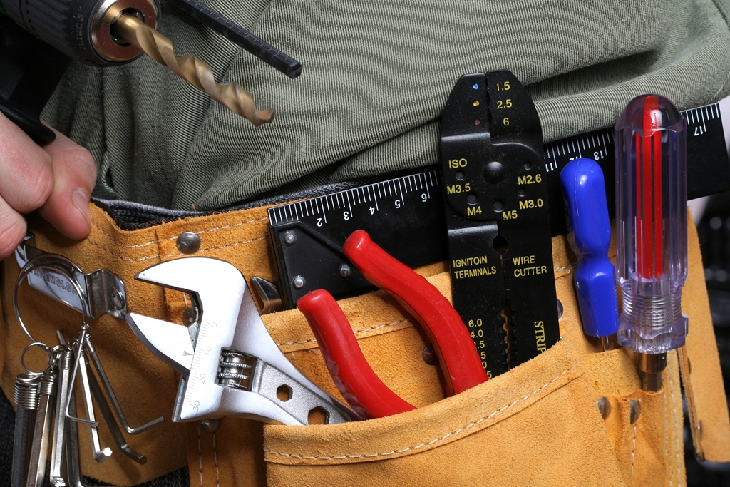 man with drill and tool belt Man with drill and tool belt