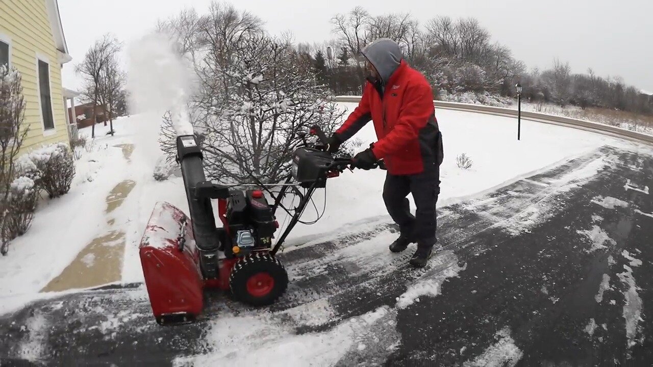 Clearing a snowy driveway with the Craftsman 28 inch two stage