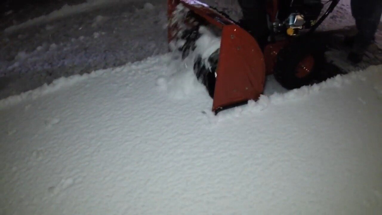 Front of the Craftsman snow blower auger housing in snow