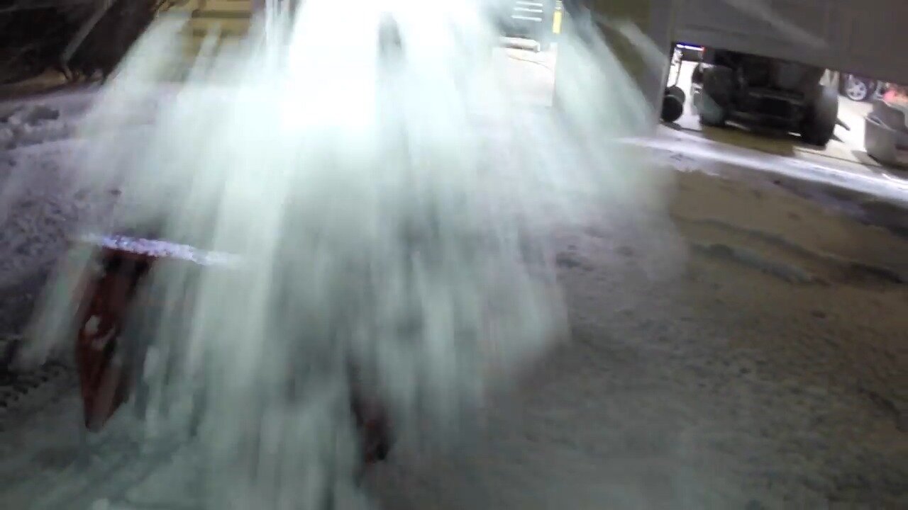 Snow blasting out of the chute of the Craftsman snow blower