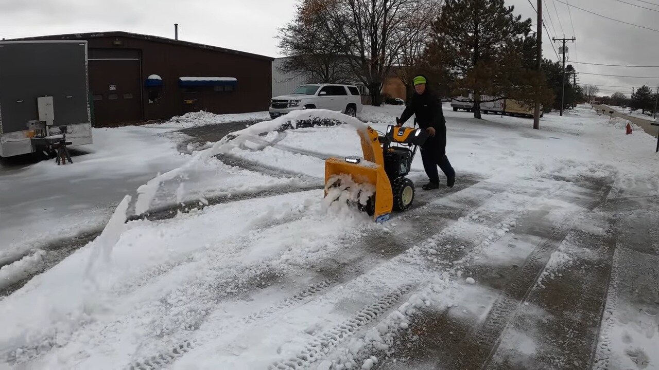 Cub Cadet 2X EFI snow blower in a snowy parking lot