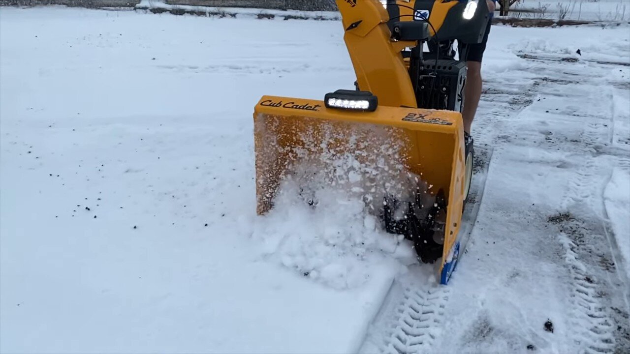 Front of the Cub Cadet 2X EFI auger housing in snow