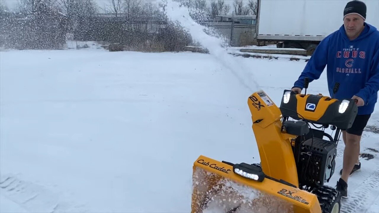 Cub Cadet 2X EFI throwing snow in a parking lot