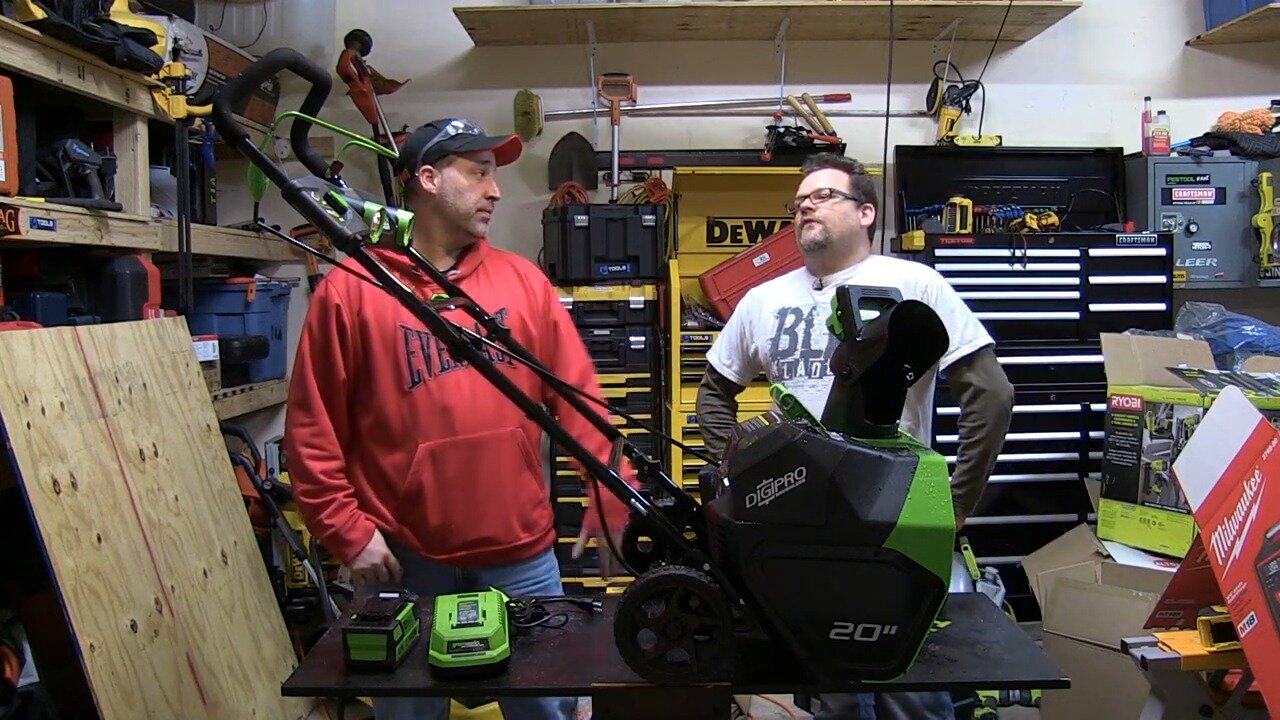 Hosts with the Greenworks 40V cordless snow blower in the shop