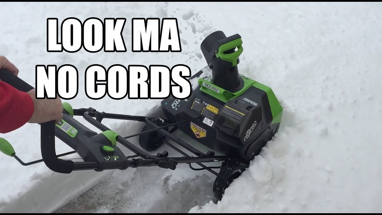 Greenworks Cordless 40V Electric Snow Blower clearing heavy snow
