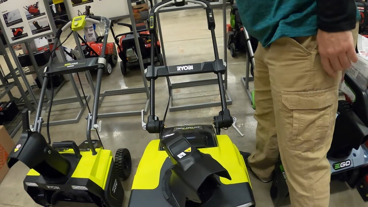 Battery single stage snow blowers on the floor at Home Depot