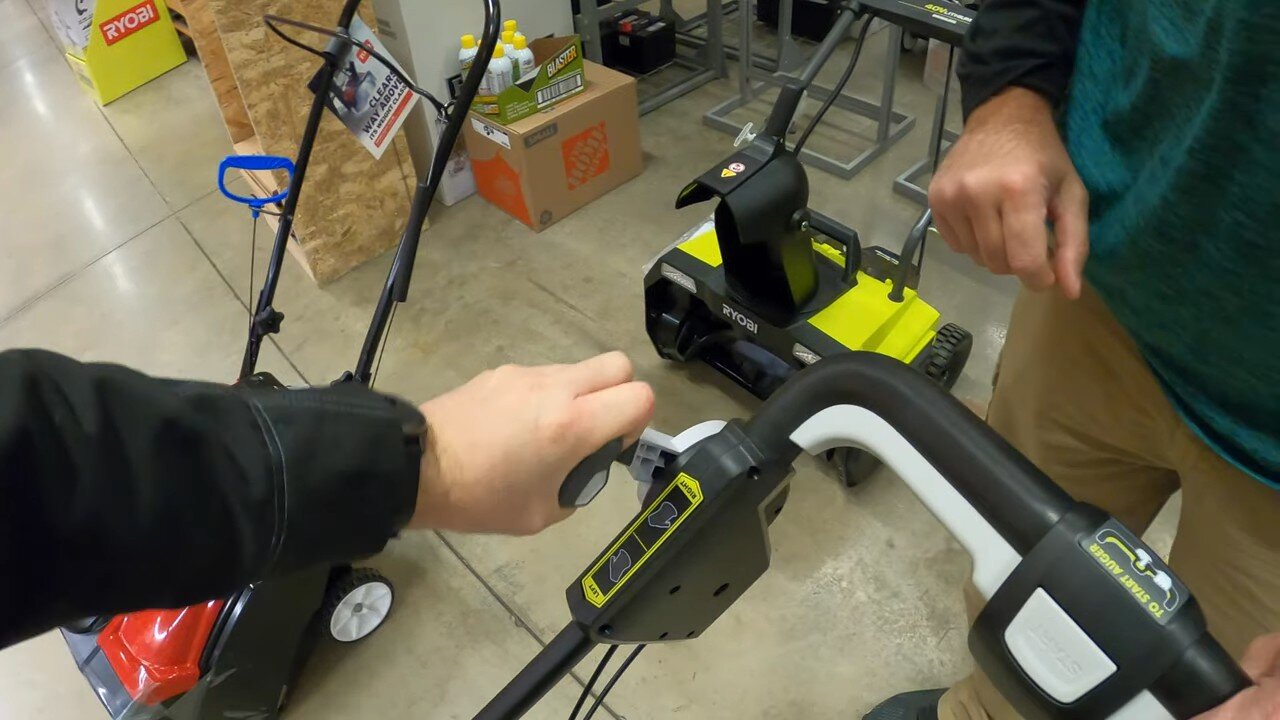 Folding handle on a battery single stage snow blower