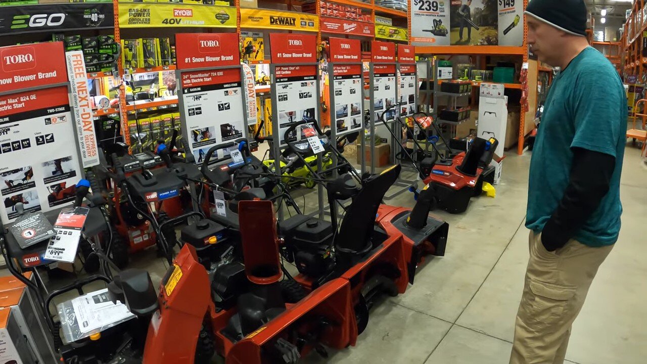 Red two-stage snow blowers on display at Home Depot