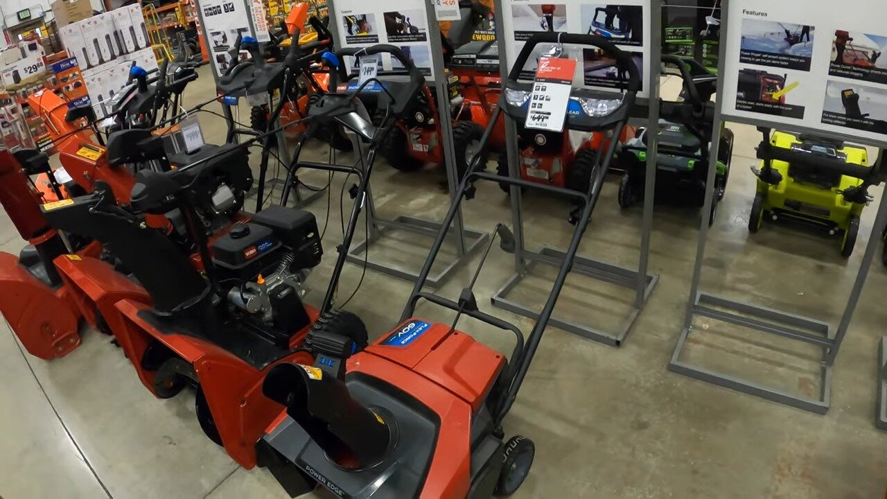 Host checking out a snow blower at Home Depot