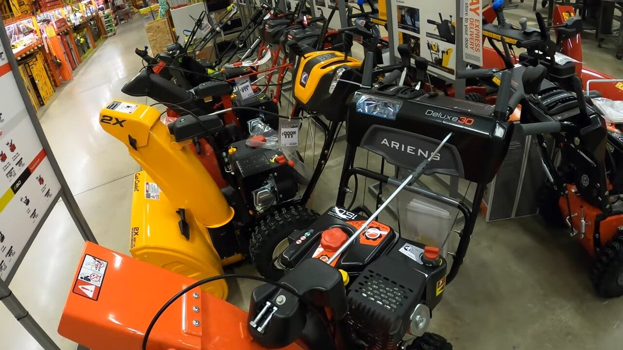 Two-stage snow blower on display at the end of the aisle