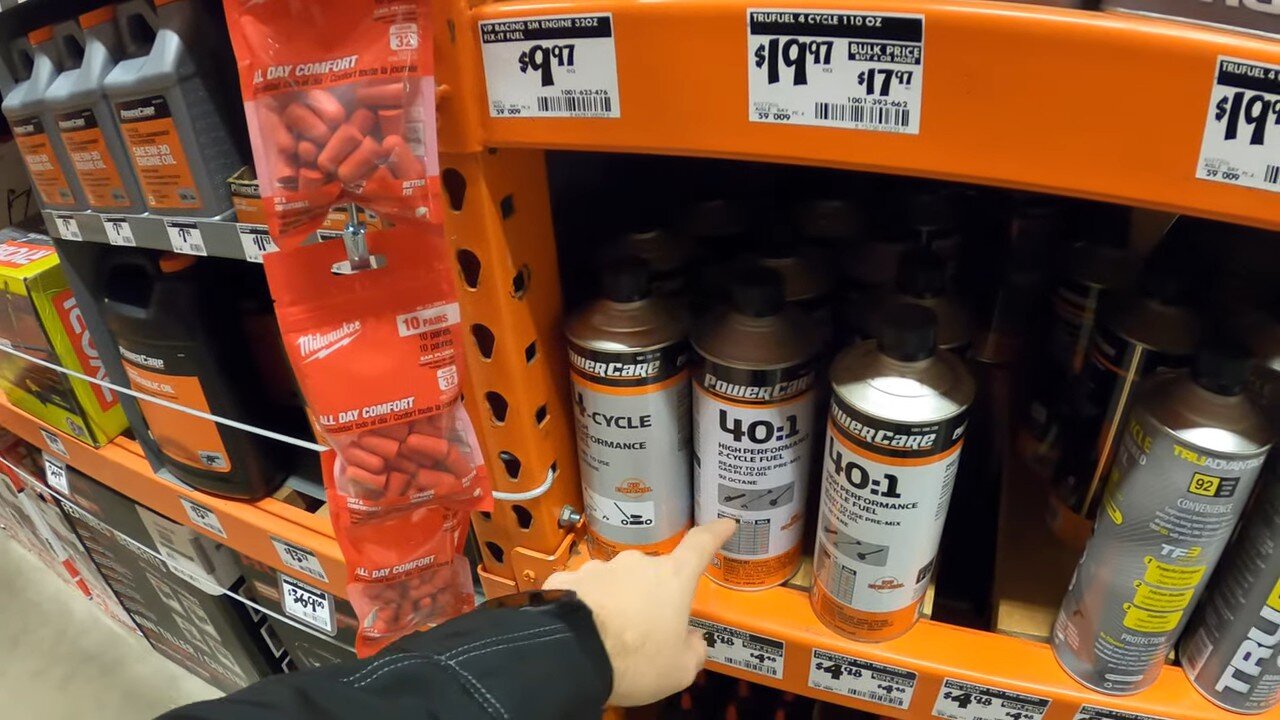 Cans of premixed fuel on a shelf at Home Depot