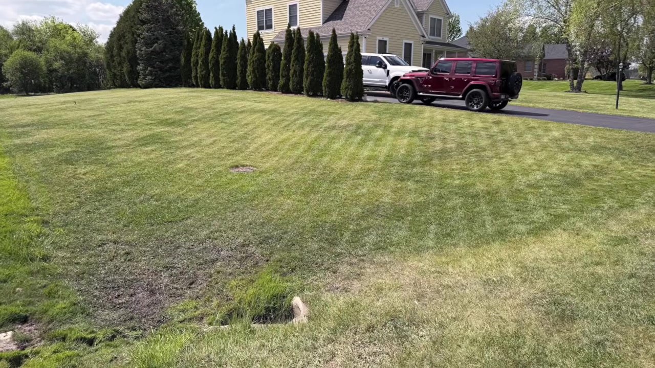 Straight mowing stripes left by the LUBA 3 AWD on a large lawn