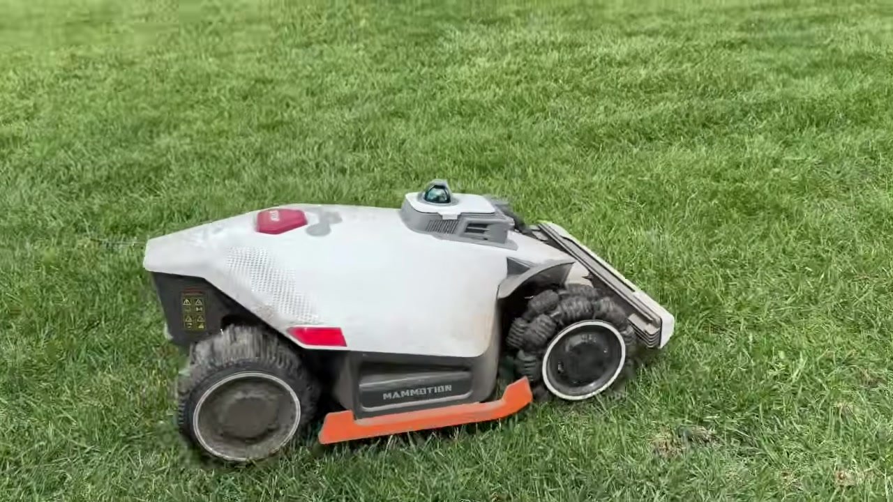 Mammotion LUBA 3 AWD robot mower on a green lawn