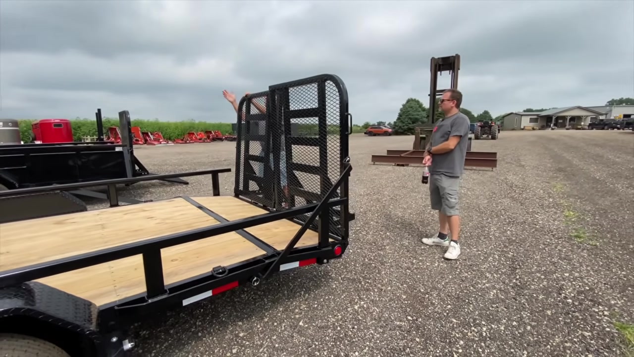 Equipment trailer with slide-in ramps and a dovetail