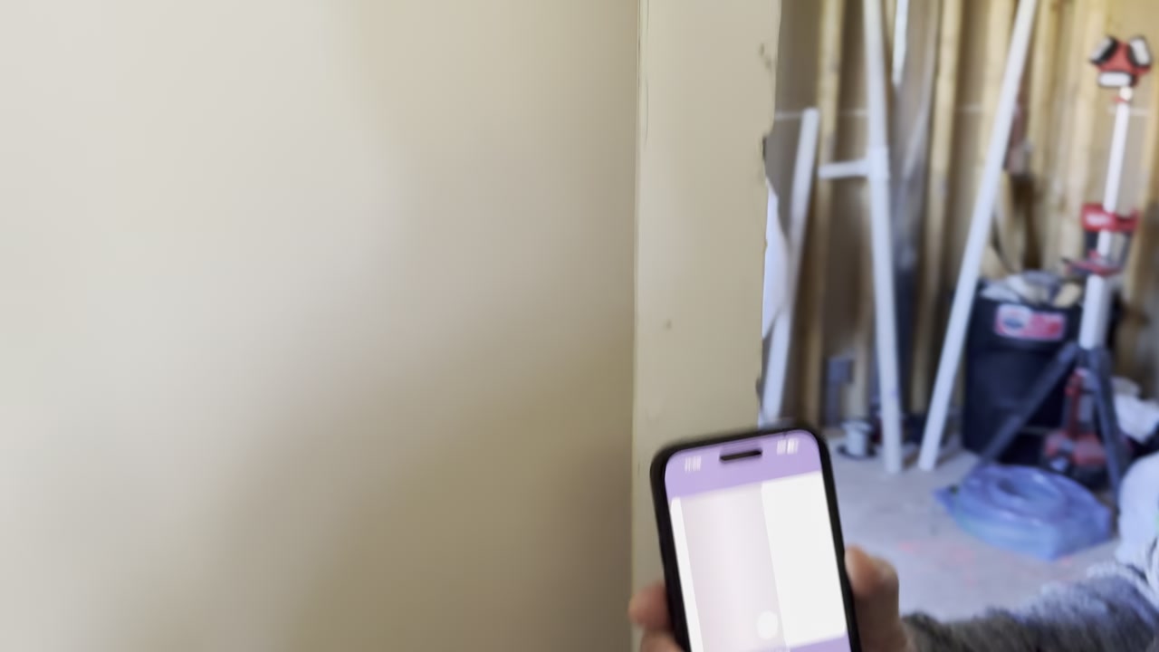 Scanning a test wall with a Walabot scanner connected to a phone