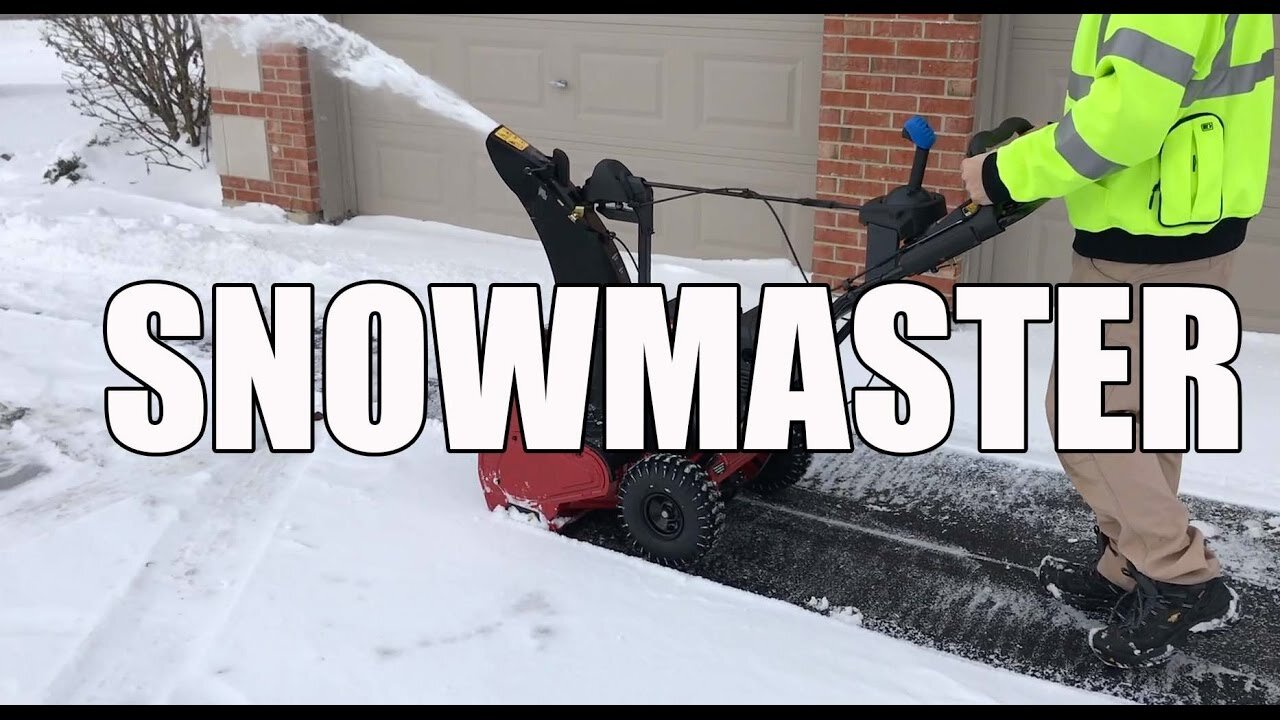 Toro 724 QXE single stage snowblower clearing a snowy driveway