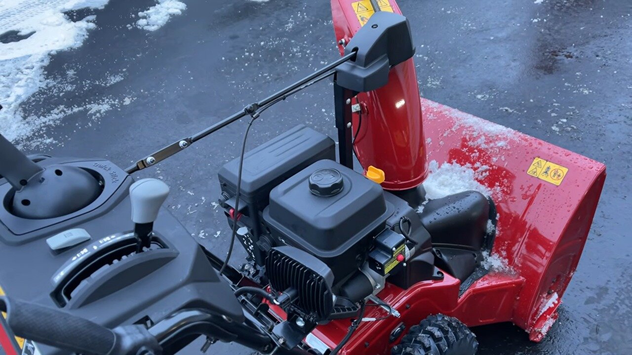 Engine and metal chute of the TORO Power Max 826 OHAE