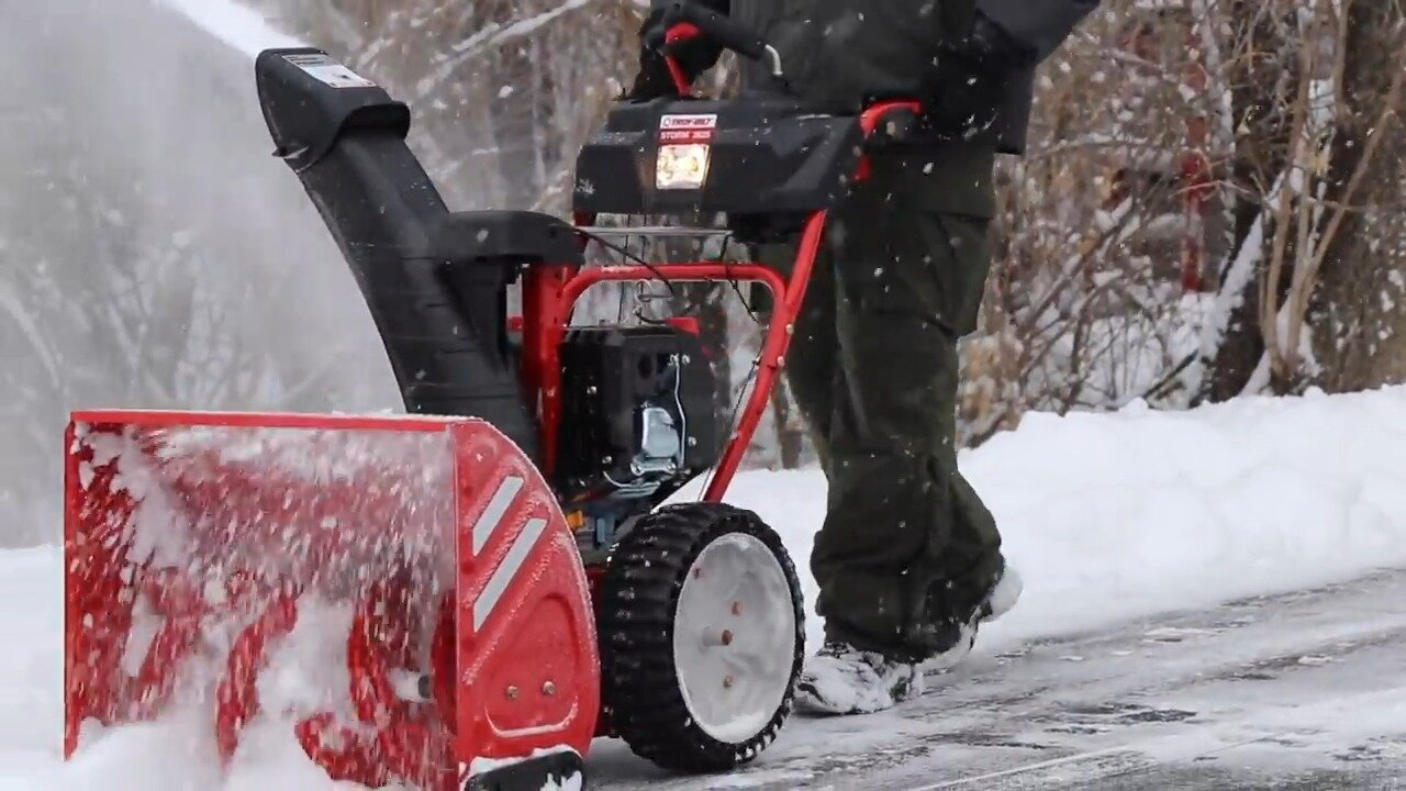 Troy Bilt two-stage snow thrower clearing snow