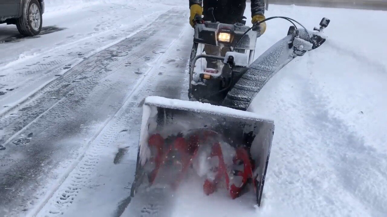 Front of the Troy Bilt snow thrower auger cutting through snow