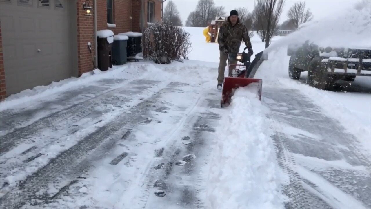 Troy Bilt Storm Tracker 2690 XP clearing a long driveway
